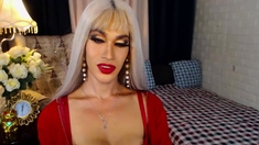 Busty blonde Asian TS wanking big cock on webcam